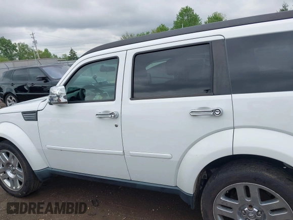 2011 Dodge Nitro Heat z VIN 1D4PU4GK7BW598432, wystawiony jako IAAI lot #42252036 z przebiegiem 148 329 mil mil oraz . Historia ofert i sprzedaży dostępna na DreamBid. Obrazek 14.