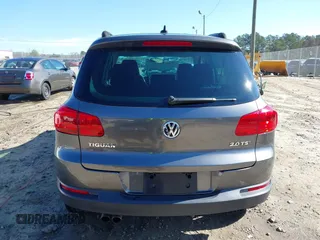 2014 Volkswagen Tiguan SE z VIN WVGAV3AX0EW511694, wystawiony jako IAAI lot #41811345 z przebiegiem 95 129 mil mil oraz . Historia ofert i sprzedaży dostępna na DreamBid. Obrazek 16.