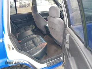 1996 Jeep Grand Cherokee Laredo with VIN 1J4GZ58YXTC329037, listed as a IAAI auction lot 42051175 with 314,571 mi miles and . Bid and sale history available at DreamBid. Image 8.
