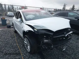 2016 Tesla Model X 70D with VIN 5YJXCBE27GF011102, listed as a IAAI auction lot 41183266 with 133,566 mi miles. Bid and sale history available at carsss.com. Image 1.