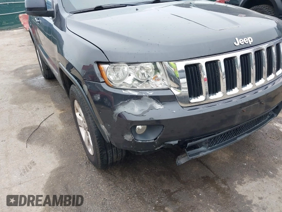 2013 Jeep Grand Cherokee Laredo with VIN 1C4RJFAG9DC506238, listed as a IAAI auction lot 41800981 with 172,676 mi miles. Bid and sale history available at carsss.com. Image 6.