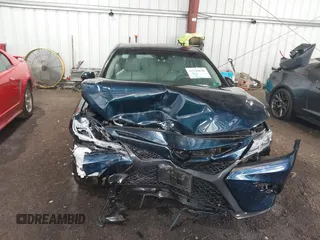 2018 Toyota Camry LE z VIN 4T1B11HK8JU517019, wystawiony jako IAAI lot #42220646 z przebiegiem 98 924 mil mil oraz . Historia ofert i sprzedaży dostępna na DreamBid. Obrazek 6.