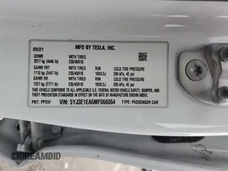 2021 Tesla Model 3 Standard Range Plus with VIN 5YJ3E1EA6MF066064, listed as a Copart auction lot 54063625 with 27,424 mi miles and Salvage Title. Bid and sale history available at DreamBid. Image 13.