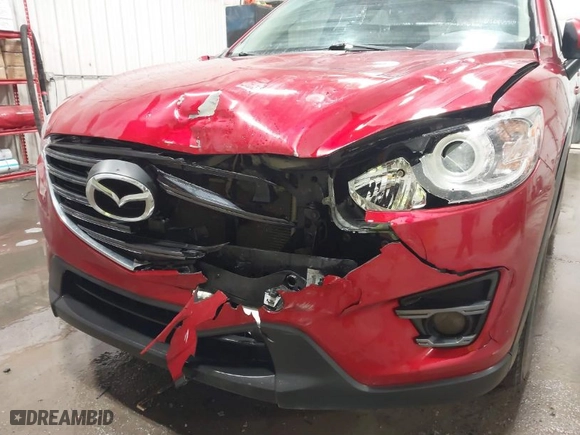 2016 Mazda CX-5 Touring with VIN JM3KE2CY5G0899995, listed as a IAAI auction lot 41743481 with NaN miles. Bid and sale history available at carsss.com. Image 6.