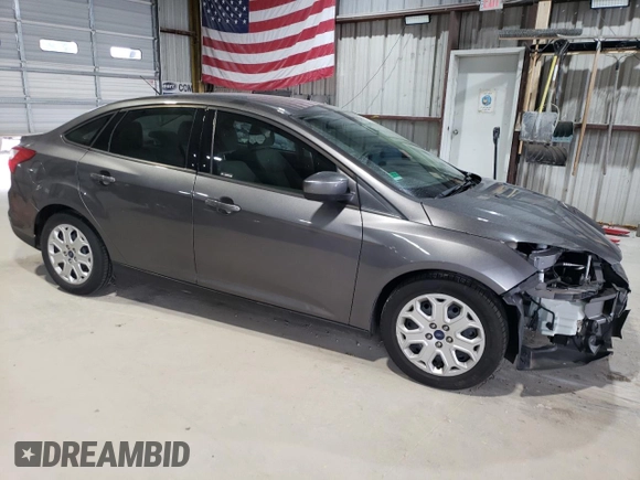 2012 Ford Focus SE z VIN 1FAHP3F28CL444261, wystawiony jako Copart lot #61174145 z przebiegiem 77 612 mil mil oraz Szkoda całkowita • Salvage title. Historia ofert i sprzedaży dostępna na DreamBid. Obrazek 4.