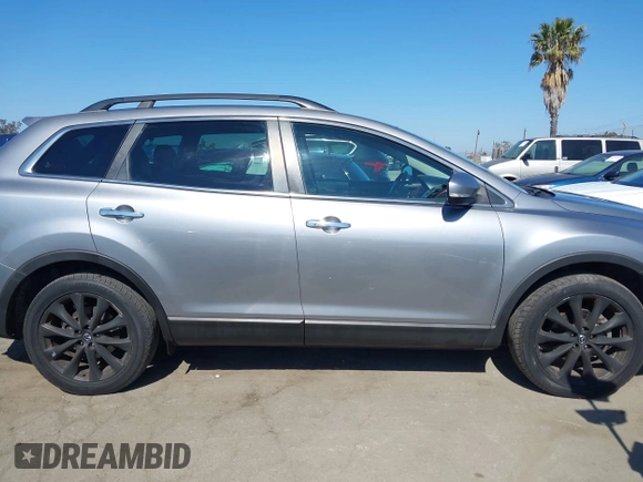 2014 Mazda CX-9 Grand Touring z VIN JM3TB3DV9E0437380, wystawiony jako IAAI lot #42298066 z przebiegiem 169 644 mil mil oraz . Historia ofert i sprzedaży dostępna na DreamBid. Obrazek 13.
