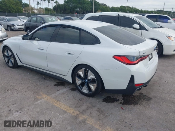 2023 BMW i4 eDrive40 z VIN WBY73AW02PFP24894, wystawiony jako IAAI lot #41097491 z przebiegiem 26 815 mil mil oraz . Historia ofert i sprzedaży dostępna na DreamBid. Obrazek 3.
