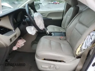 2015 Toyota Sienna LE with VIN 5TDJK3DCXFS126604, listed as a Copart auction lot 56987355 with 102,079 mi miles and Salvage title. Bid and sale history available at DreamBid. Image 7.