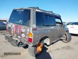 1995 Suzuki Sidekick JX z VIN 2S3TD03V3S6406536, wystawiony jako IAAI lot #40878592 z przebiegiem 253 055 mil mil oraz . Historia ofert i sprzedaży dostępna na DreamBid. Obrazek 4.