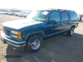 1996 GMC Suburban with VIN 1GDEC16R5TJ742543, listed as a IAAI auction lot 41910103 with 159,469 mi miles and . Bid and sale history available at DreamBid. Image 2.