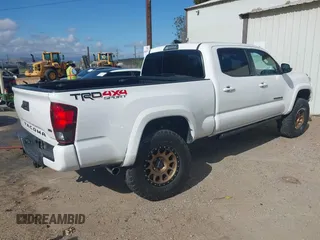 2018 Toyota Tacoma SR5 with VIN 3TMDZ5BN2JM037580, listed as a IAAI auction lot 42248418 with 35,661 mi miles and . Bid and sale history available at DreamBid. Image 4.