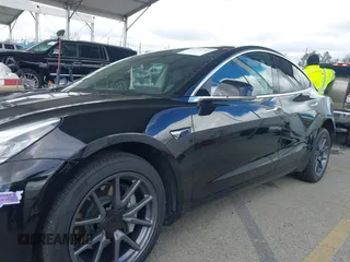 2019 Tesla Model 3 Mid Range with VIN 5YJ3E1EA3KF325056, listed as a IAAI auction lot 41771543 with 183,157 mi miles and . Bid and sale history available at carsss.com. Image 14.