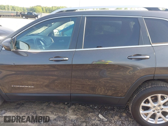 2014 Jeep Cherokee Latitude with VIN 1C4PJLCB6EW241897, listed as a IAAI auction lot 42128880 with 126,242 mi miles. Bid and sale history available at carsss.com. Image 14.
