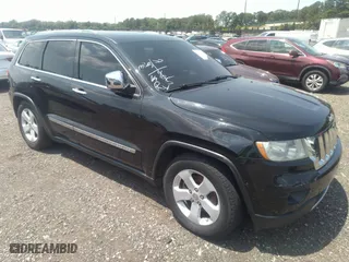 2012 Jeep Grand Cherokee Overland with VIN 1C4RJFCG7CC220416, listed as a IAAI auction lot 37034582 with 167,714 mi miles. Bid and sale history available at carsss.com. Image 1.
