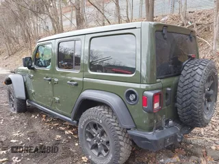 2021 Jeep Wrangler Unlimited Willys with VIN 1C4HJXDNXMW579595, listed as a IAAI auction lot 41930989 with 32,148 mi miles and . Bid and sale history available at DreamBid. Image 3.