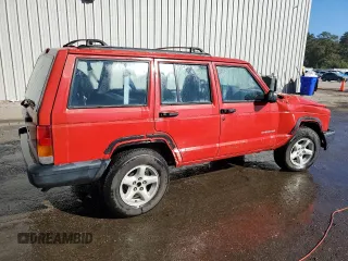 1999 Jeep Cherokee SE with VIN 1J4FT28S6XL515896, listed as a Copart auction lot 83745444 with 192,406 mi miles and Salvage title. Bid and sale history available at DreamBid. Image 3.
