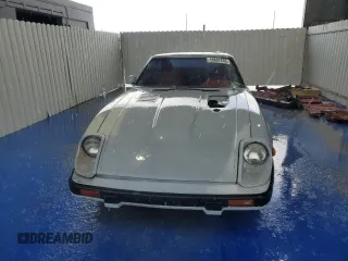 1982 Datsun 280ZX z VIN JN1HZ04S5CX431646, wystawiony jako Copart lot #55607255 z przebiegiem 173 546 mil mil oraz Tytuł czysty. Historia ofert i sprzedaży dostępna na DreamBid. Obrazek 5.