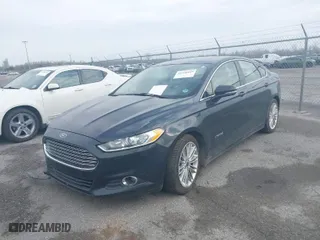 2014 Ford Fusion SE Hybrid with VIN 3FA6P0LU7ER282848, listed as a IAAI auction lot 41560449 with 180,696 mi miles. Bid and sale history available at carsss.com. Image 2.