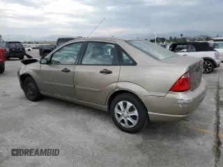 2005 Ford Focus S with VIN 1FAFP34N55W105530, listed as a Copart auction lot 59186695 with 136,204 mi miles and Salvage title. Bid and sale history available at DreamBid. Image 2.