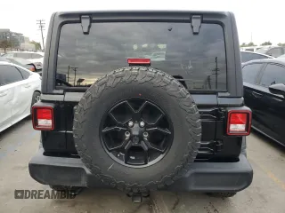 2022 Jeep Wrangler Unlimited High Tide with VIN 1C4HJXDG4NW179888, listed as a Copart auction lot 82601624 with 15,631 mi miles and Salvage Title. Bid and sale history available at DreamBid. Image 6.