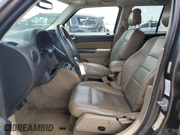 2014 Jeep Patriot High Altitude with VIN 1C4NJPFA2ED888925, listed as a Copart auction lot 60191435 with 122,308 mi miles and Salvage title. Bid and sale history available at DreamBid. Image 7.