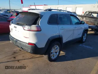 2019 Jeep Cherokee Trailhawk with VIN 1C4PJMBX8KD313712, listed as a IAAI auction lot 41448146 with 96,293 mi miles and . Bid and sale history available at DreamBid. Image 4.