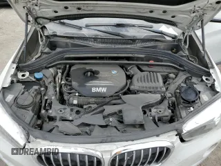 2018 BMW X1 sDrive28i with VIN WBXHU7C37J5H44386, listed as a Copart auction lot 42167135 with 96,668 mi miles and Salvage Title. Bid and sale history available at DreamBid. Image 12.