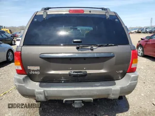 2000 Jeep Grand Cherokee Laredo z VIN 1J4GW48N9YC239166, wystawiony jako Copart lot #53321135 z przebiegiem 142 162 mil mil oraz Szkoda całkowita • Salvage title. Historia ofert i sprzedaży dostępna na DreamBid. Obrazek 6.