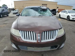 2009 Lincoln MKS z VIN 1LNHM93R89G601548, wystawiony jako Copart lot #54336075 z przebiegiem 318 143 mil mil oraz Szkoda całkowita • Salvage title. Historia ofert i sprzedaży dostępna na DreamBid. Obrazek 5.
