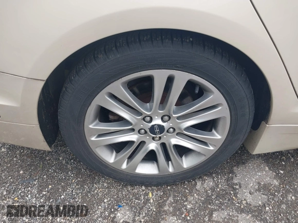 2014 Lincoln MKZ Hybrid with VIN 3LN6L2LU8ER813195, listed as a IAAI auction lot 42578644 with 153,893 mi miles and . Bid and sale history available at DreamBid. Image 12.