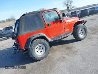 2005 Jeep Wrangler Sport with VIN 1J4FA49S85P344204, listed as a IAAI auction lot 41769319 with 105,927 mi miles. Bid and sale history available at carsss.com. Image 4.