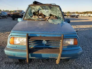 1992 Suzuki Sidekick z VIN 2S3TC01C2N6405497, wystawiony jako Copart lot #75856164 z przebiegiem 38 423 mil mil oraz Szkody całkowita. Historia ofert i sprzedaży dostępna na DreamBid. Obrazek 5.