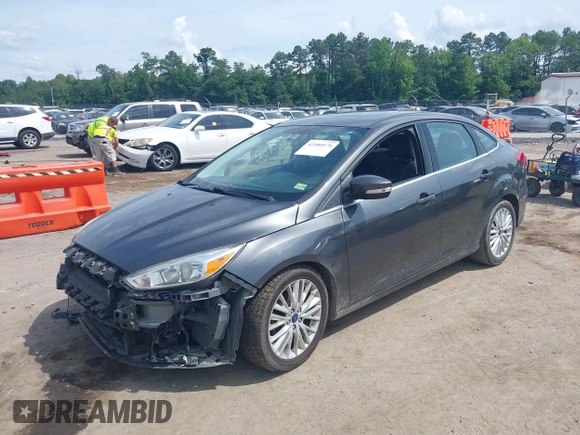 2017 Ford Focus Titanium with VIN 1FADP3J27HL306546, listed as a IAAI auction lot 42480576 with 114,285 mi miles and . Bid and sale history available at DreamBid. Image 2.