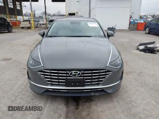 2022 Hyundai Sonata Hybrid Blue with VIN KMHL24JJ2NA048439, listed as a IAAI auction lot 40942477 with 64,855 mi miles. Bid and sale history available at carsss.com. Image 13.