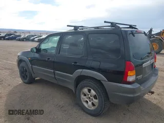 2001 Mazda Tribute LX with VIN 4F2CU08191KM27990, listed as a IAAI auction lot 41487001 with 209,394 mi miles and . Bid and sale history available at carsss.com. Image 3.