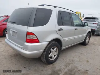 2001 Mercedes-Benz M-Class with VIN 4JGAB54E71A231597, listed as a IAAI auction lot 42058829 with 233,005 mi miles. Bid and sale history available at carsss.com. Image 4.