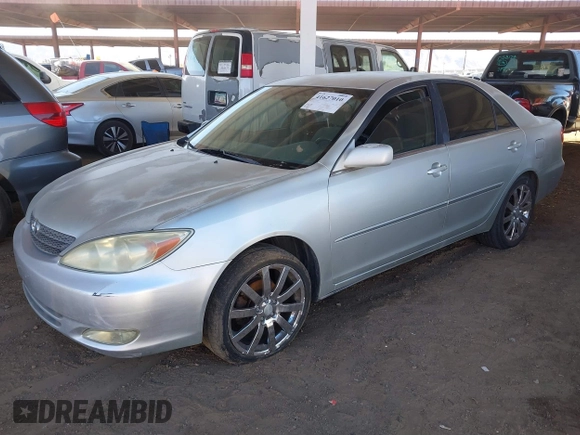 2003 Toyota Camry LE with VIN JTDBE32K730176610, listed as a IAAI auction lot 41627010 with 238,502 mi miles and . Bid and sale history available at DreamBid. Image 2.