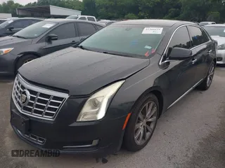 2014 Cadillac XTS z VIN 2G61L5S32E9326141, wystawiony jako IAAI lot #42300854 z przebiegiem 200 284 mil mil oraz . Historia ofert i sprzedaży dostępna na DreamBid. Obrazek 2.