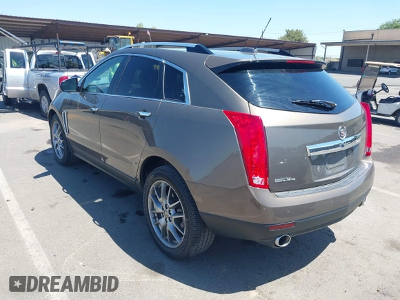 2015 Cadillac SRX Performance Collection with VIN 3GYFNFE35FS569682, listed as a IAAI auction lot 42322229 with 124,365 mi miles and . Bid and sale history available at DreamBid. Image 3.
