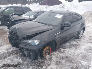 2011 BMW X6 M with VIN 5YMGZ0C57BLK14388, listed as a IAAI auction lot 41411854 with 129,248 mi miles. Bid and sale history available at carsss.com. Image 18.