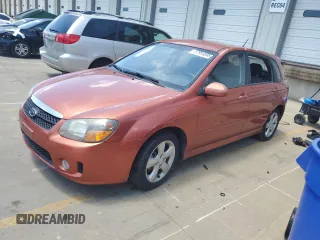 2009 Kia Spectra Spectra5 z VIN KNAFE241795025095, wystawiony jako Copart lot #57964095 z przebiegiem 210 512 mil mil oraz Szkoda całkowita • Salvage title. Historia ofert i sprzedaży dostępna na DreamBid. Obrazek 1.