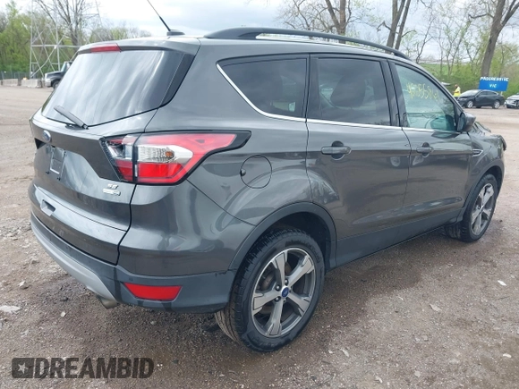 2017 Ford Escape SE with VIN 1FMCU9GD4HUE45193, listed as a IAAI auction lot 42055861 with 154,961 mi miles and . Bid and sale history available at DreamBid. Image 4.