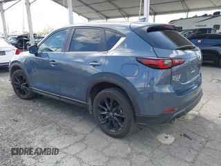 2023 Mazda CX-5 S Carbon Edition z VIN JM3KFBCM5P0179543, wystawiony jako IAAI lot #41950082 z przebiegiem 31 573 mil mil oraz . Historia ofert i sprzedaży dostępna na DreamBid. Obrazek 3.