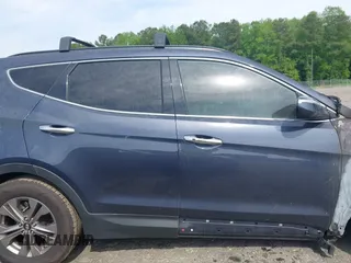 2016 Hyundai Santa Fe z VIN 5XYZU3LB4GG308030, wystawiony jako IAAI lot #42102832 z przebiegiem Nie podano mil oraz . Historia ofert i sprzedaży dostępna na DreamBid. Obrazek 12.
