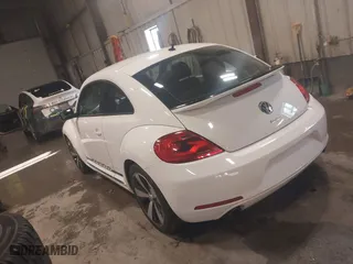 2012 Volkswagen Beetle 2.0T Turbo PZEV with VIN 3VWVA7AT4CM603293, listed as a IAAI auction lot 41633664 with 91,410 mi miles. Bid and sale history available at carsss.com. Image 3.