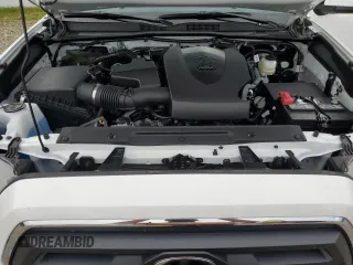2023 Toyota Tacoma SR with VIN 3TMCZ5AN2PM642205, listed as a Copart auction lot 61045955 with 10,596 mi miles and Salvage title. Bid and sale history available at DreamBid. Image 11.