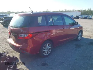 2014 Mazda Mazda5 Sport with VIN JM1CW2BLXE0163650, listed as a IAAI auction lot 42024762 with 137,314 mi miles. Bid and sale history available at carsss.com. Image 4.