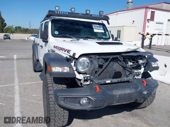 2022 Jeep Gladiator Mojave z VIN 1C6JJTEG0NL103523, wystawiony jako IAAI lot #41842011 z przebiegiem 36 160 mil mil oraz . Historia ofert i sprzedaży dostępna na DreamBid. Obrazek 1.