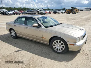 2004 Jaguar XJ with VIN SAJWA71C24SG28164, listed as a Copart auction lot 73968134 with 0 mi miles and Salvage Title. Bid and sale history available at carsss.com. Image 4.