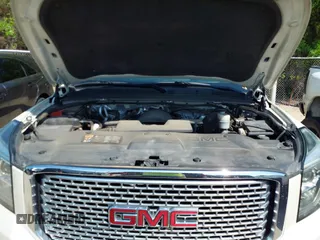 2015 GMC Yukon Denali with VIN 1GKS1CKJ8FR575730, listed as a IAAI auction lot 42048050 with 113,077 mi miles. Bid and sale history available at carsss.com. Image 10.